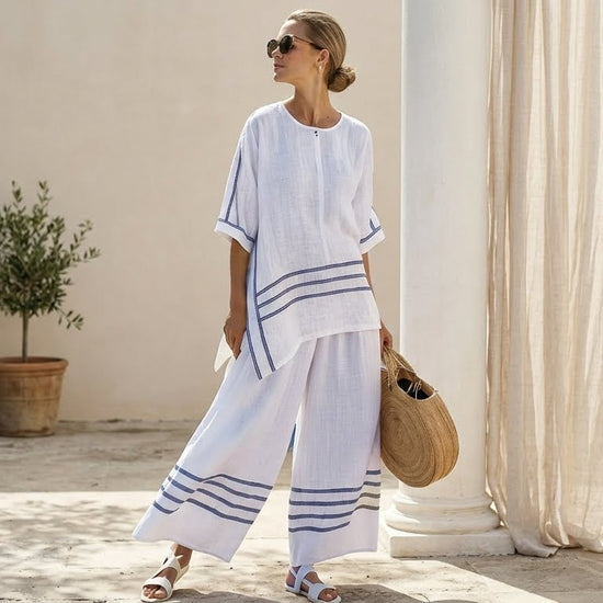 Vittorina – top asimétrico de rayas sofisticado, combinado con pantalones audaces