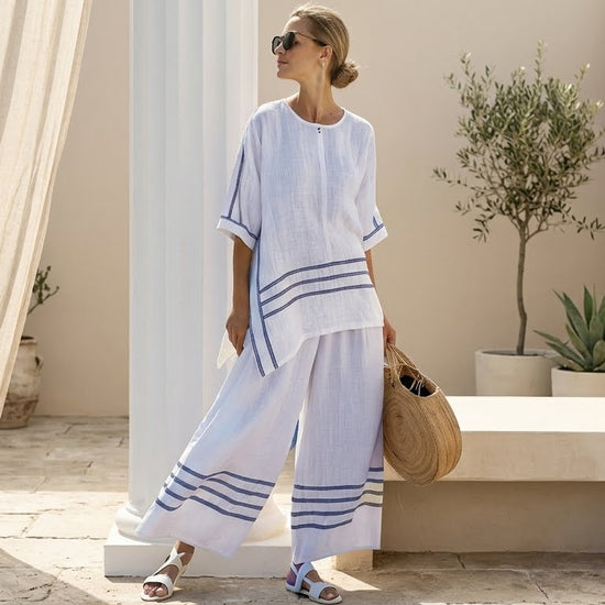 Vittorina – top asimétrico de rayas sofisticado, combinado con pantalones audaces